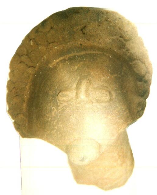 eine Tonmaske aus Ghana