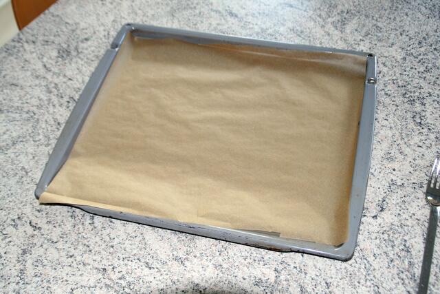 Blech mit Trennpapier belegen