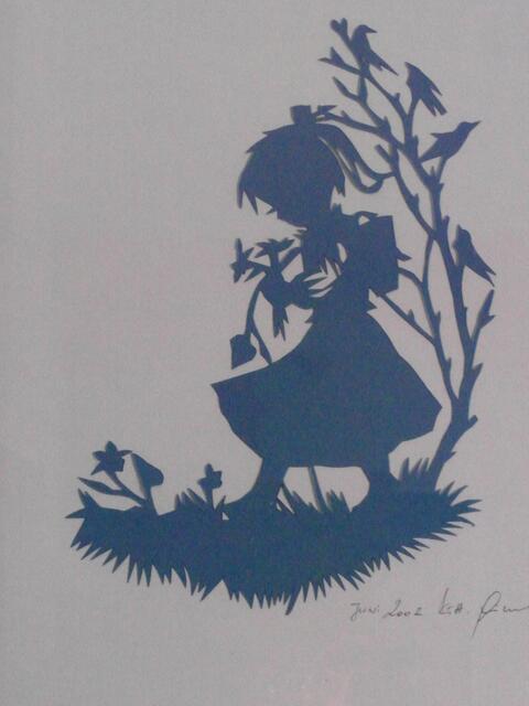 Scherenschnitt unter Glas