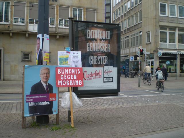 BAKI-Plakat zum 1. Mai 2015 auf dem Bremer Domshof nach der DGB-Kundgebung