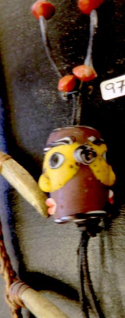 Glasperle  mit zwei Gesichtern aus punischer Zeit