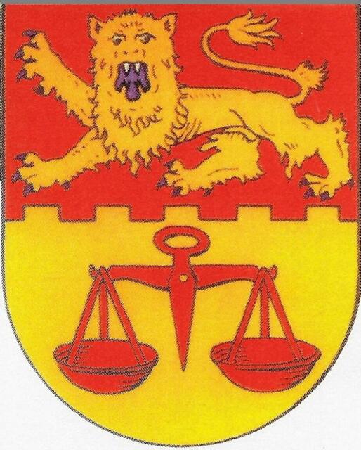 Das Wappen von Koldingen von 1964. Angelehnt an das Siegel der Amtmänner von Coldingen. Ein welfischer Löwe mit blauer Zunge auf Burgzinnen. Darunter die Waage als Symbol für die richterlichen Befugnisse der Amtmänner bis 1824.