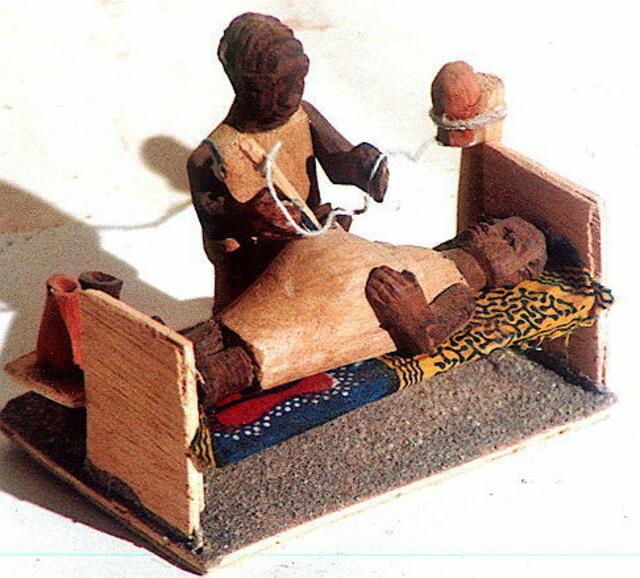 Aus Abfallhölzchen gebastelt zeigt ein Junge aus Nigeria ,was er gerne werden will