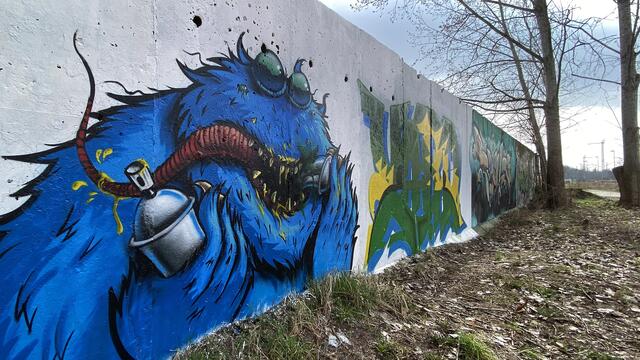   Fantasiewelten auf der Mauer. („Graffiti Hall“ am Platten Kamp.) Foto: Helmut Kuzina
