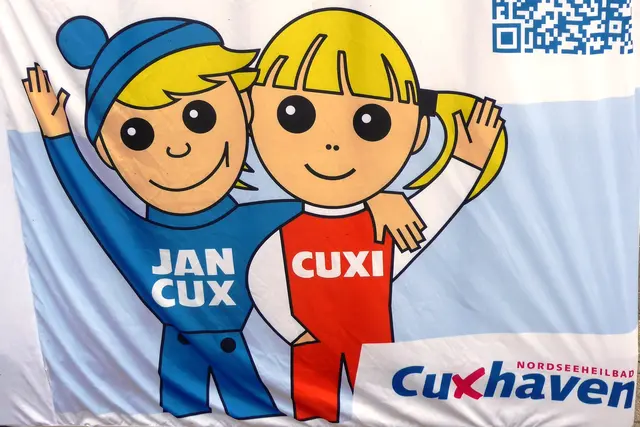 Jan Cux und Cuxi grüßen aus dem Nordseeheilbad Cuxhaven.