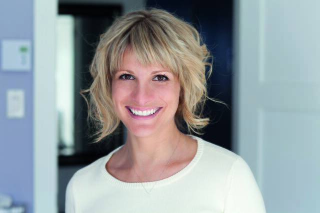 Portrait Of A Mature Woman Smiling At the Camera At Home
